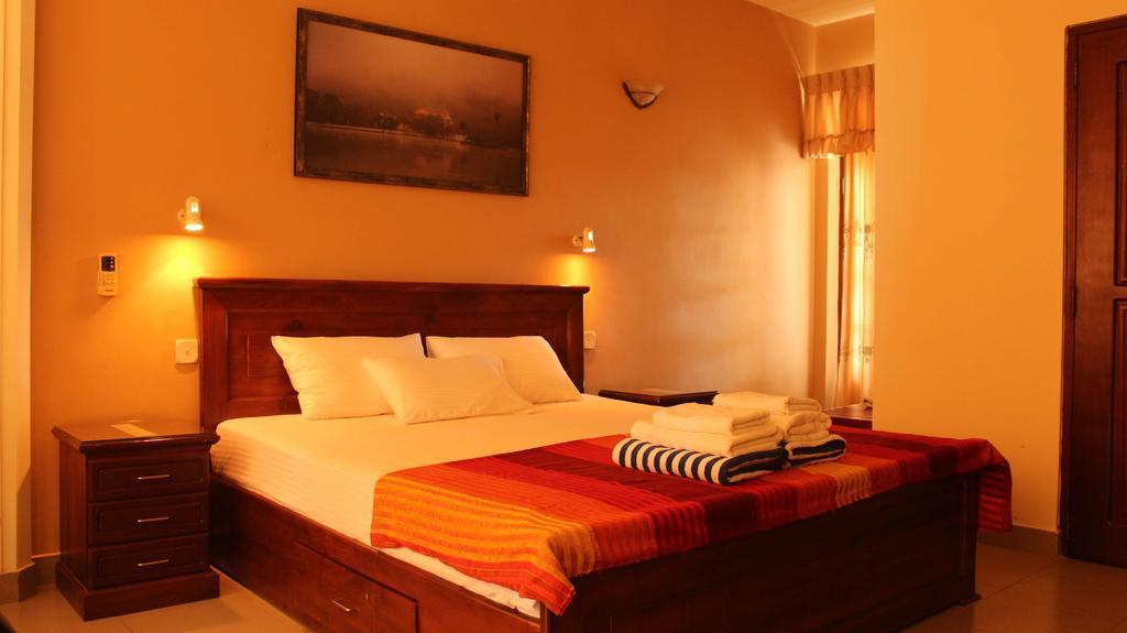 Janishi Residencies Hotel Negombo Kamer foto